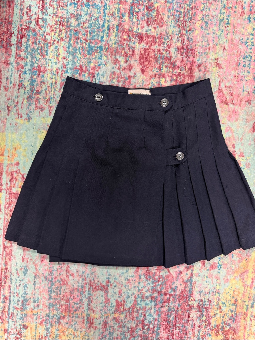 Pleated Navy Mini Skirt with Button Tabs